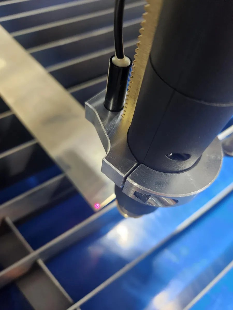 Torch mounted laser pointer